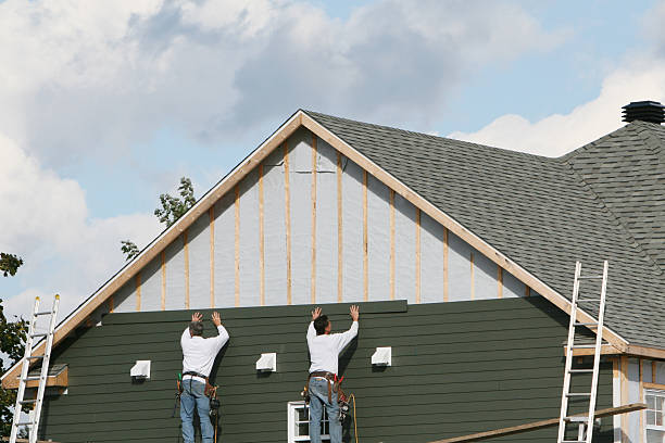 Professional Siding Replacement technician working in Helmetta, NJ